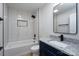 Bathroom featuring a tiled shower/tub combo, granite countertop, and modern fixtures at 324 Cabarrus W Ave, Concord, NC 28025