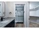 Modern bathroom with a glass-enclosed shower, granite countertop vanity, and stylish fixtures at 324 Cabarrus W Ave, Concord, NC 28025