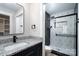 Well-designed bathroom with a glass shower enclosure, granite countertops, and sleek finishes at 324 Cabarrus W Ave, Concord, NC 28025