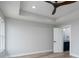 Bright bedroom featuring wood floors, a ceiling fan, and an ensuite bathroom at 324 Cabarrus W Ave, Concord, NC 28025