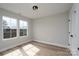 Light-filled bedroom with wood-look floors and neutral wall color at 324 Cabarrus W Ave, Concord, NC 28025