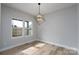 Bright dining room featuring natural light and a modern light fixture at 324 Cabarrus W Ave, Concord, NC 28025