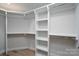 Bright, white walk-in closet with built-in shelving and ample storage space at 324 Cabarrus W Ave, Concord, NC 28025