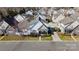 An aerial view showcases this lovely home's manicured lawn, stone accents and neighborhood at 3320 Tulip Tree Ln, Charlotte, NC 28273