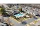 Aerial view of the community pool, clubhouse, and surrounding residences at 3320 Tulip Tree Ln, Charlotte, NC 28273