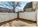 A backyard is surrounded by a tall fence providing privacy and security at 3320 Tulip Tree Ln, Charlotte, NC 28273