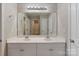 Bathroom features double sinks and a large mirror at 3320 Tulip Tree Ln, Charlotte, NC 28273