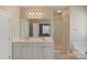 Bathroom boasts double sink vanity, large mirror, and glass enclosed shower at 3320 Tulip Tree Ln, Charlotte, NC 28273