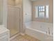 Bathroom boasts a soaking tub and glass enclosed shower at 3320 Tulip Tree Ln, Charlotte, NC 28273