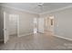 Spacious carpeted bedroom with ensuite bathroom and walk-in closet at 3320 Tulip Tree Ln, Charlotte, NC 28273