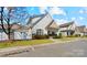 Attractive home with stone accents, a well-kept lawn, and a welcoming entrance at 3320 Tulip Tree Ln, Charlotte, NC 28273