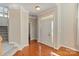 Inviting foyer with hardwood floors, staircase, and ample natural light from the front door at 3320 Tulip Tree Ln, Charlotte, NC 28273