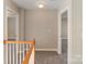 A carpeted hallway provides access to the rooms in this lovely home at 3320 Tulip Tree Ln, Charlotte, NC 28273