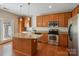 Well-equipped kitchen with stainless steel appliances, granite countertops, and a center island at 3320 Tulip Tree Ln, Charlotte, NC 28273