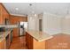 Spacious kitchen with an island, stainless steel appliances, and granite countertops at 3320 Tulip Tree Ln, Charlotte, NC 28273