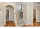 Open foyer with carpeted stairway and wood floors at 3320 Tulip Tree Ln, Charlotte, NC 28273