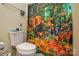 Bathroom showing a toilet and safari-themed shower curtain with zebras, elephants and flamingos at 3345 Hunting Wood Ct, Gastonia, NC 28052