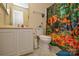 A bathroom featuring a vanity with a sink, toilet, and shower with colorful safari themed curtain at 3345 Hunting Wood Ct, Gastonia, NC 28052