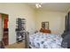 Bedroom featuring bed with a floral comforter, dresser, and a shoe rack at 3345 Hunting Wood Ct, Gastonia, NC 28052