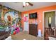 Colorful Bedroom featuring vibrant wallpaper, a changing table, and cozy seating at 3345 Hunting Wood Ct, Gastonia, NC 28052