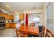 Charming dining area with wooden table, chandelier, and sliding glass doors to outdoor space at 3345 Hunting Wood Ct, Gastonia, NC 28052