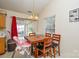 Cozy dining area with natural light and a wooden table, perfect for Gathering meals at 3345 Hunting Wood Ct, Gastonia, NC 28052