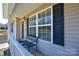 Inviting front porch with ample natural light streaming through the large windows at 3345 Hunting Wood Ct, Gastonia, NC 28052