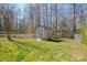 Backyard shed with a fenced in yard and sparse trees at 3345 Hunting Wood Ct, Gastonia, NC 28052