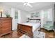 Cozy bedroom featuring a wood bed frame, soft natural light, and decorative accents at 3615 Henshaw Rd, Charlotte, NC 28209