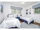 Charming bedroom with two twin beds and colorful decor at 3615 Henshaw Rd, Charlotte, NC 28209