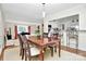 Inviting dining area open to the living room and kitchen, perfect for entertaining at 3615 Henshaw Rd, Charlotte, NC 28209