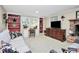 Cozy living room with built-in shelving, desk, fireplace, and comfortable seating at 3615 Henshaw Rd, Charlotte, NC 28209