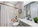 Modern bathroom with a shower, tub, and a gray vanity with a white countertop at 388 Speedway Nw Pl # 1, Concord, NC 28027