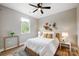 Bright bedroom with decorative wall baskets, a ceiling fan, and natural light from the window at 388 Speedway Nw Pl # 1, Concord, NC 28027