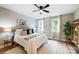 Bright bedroom with a ceiling fan, featuring a cozy rug and decorative accents at 388 Speedway Nw Pl # 1, Concord, NC 28027