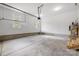 Spacious garage with concrete floor, natural light, and overhead door at 388 Speedway Nw Pl # 1, Concord, NC 28027