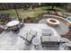 Rear patio area features seating, tables, fire pit and backyard play equipment at 4000 Bridgewood Ln, Charlotte, NC 28226