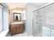 Stylish bathroom featuring a glass-enclosed shower, a vanity with storage, and modern fixtures at 4000 Bridgewood Ln, Charlotte, NC 28226