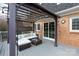 Back deck featuring a pergola, ceiling fan, outdoor furniture and brick exterior at 4000 Bridgewood Ln, Charlotte, NC 28226