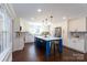 Bright kitchen features white cabinets, a large island, and modern stainless steel appliances at 4000 Bridgewood Ln, Charlotte, NC 28226