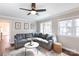 Comfortable living room with hardwood floors, a comfortable sectional sofa, and bright natural light at 4000 Bridgewood Ln, Charlotte, NC 28226