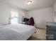 Serene bedroom featuring soft, natural light and a minimalist decor at 4075 Creekstone Trce, Gastonia, NC 28056