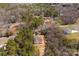 An aerial view capturing this home's position within a wooded area near other homes, showcasing its surroundings at 433 Cornerstone Dr, Taylorsville, NC 28681