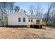 Picture of a modern home's back exterior with a wooden deck, offering a serene outdoor living space at 433 Cornerstone Dr, Taylorsville, NC 28681