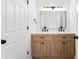 Modern bathroom with a double sink vanity with black hardware, a white countertop and wood cabinets at 433 Cornerstone Dr, Taylorsville, NC 28681