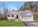 Charming one-story home features white siding, a two-car garage, and a well-maintained lawn at 433 Cornerstone Dr, Taylorsville, NC 28681