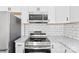 Kitchen featuring stainless steel appliances, granite countertops and white cabinets at 433 Cornerstone Dr, Taylorsville, NC 28681