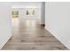 Bright and airy living room featuring wood floors, white walls, and natural light from the windows at 433 Cornerstone Dr, Taylorsville, NC 28681