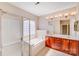 Bright bathroom with a soaking tub, double vanity, and a glass-enclosed shower at 485 Sutro Forest Nw Dr, Concord, NC 28027