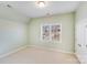 A brightly-lit bedroom features a large window and neutral walls, creating a serene and inviting atmosphere at 485 Sutro Forest Nw Dr, Concord, NC 28027